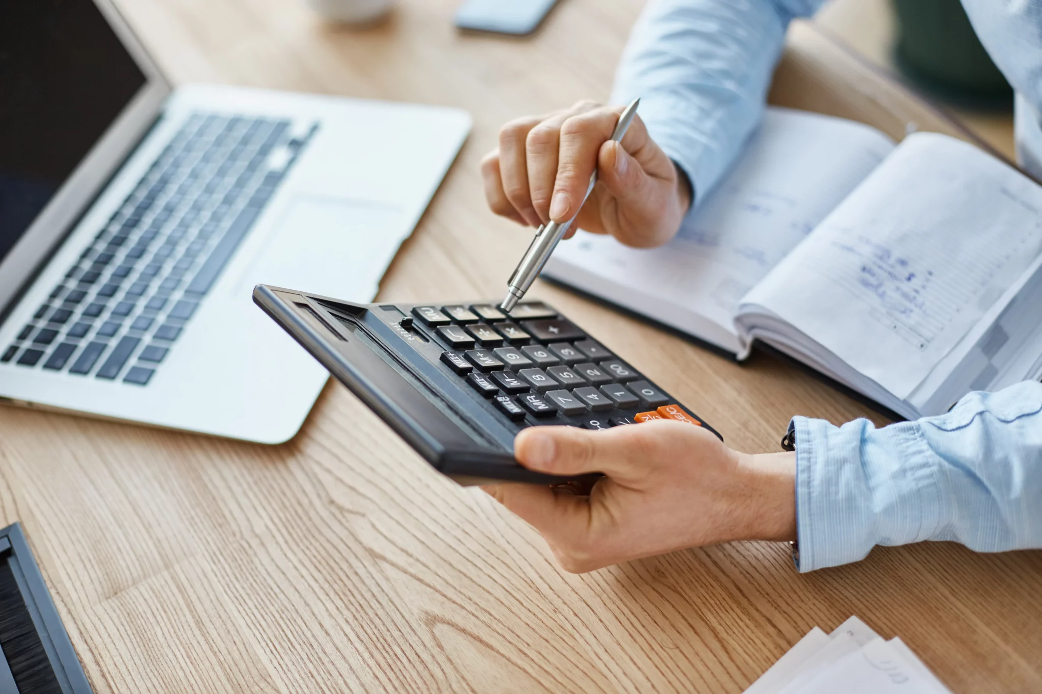 finance-manager-holding-calculator-hands